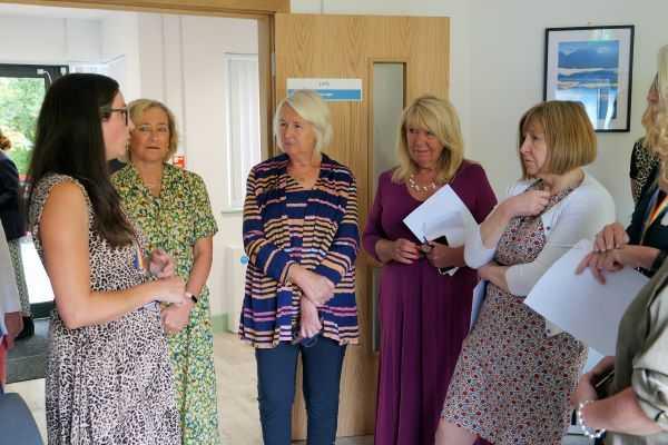 Group of people attending mental health crisis hub.