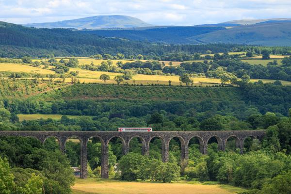 Train Passing over Cynghordy Viaduct with the Western Brecon Beacons in the distance
